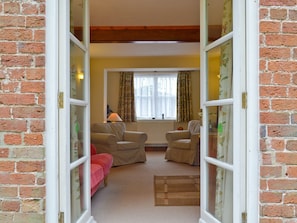 Living room through French doors | Garden Farm Cottage, Ilam, near Ashbourne