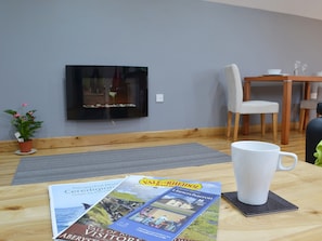 Relax in front of the contemporary fireplace | The Loft, Ciliau Aeron, near Aberaeron