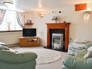 Warm and welcoming living room | Deuglawdd Cottage - Deuglawdd Farm , Aberdaron, near Pwllheli 