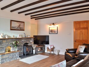 Living room with wood beamed ceiling | Dyffryn Haidd - Afan Holiday Cottages, llanafan/Aberystwyth
