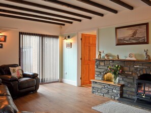 Living room with wood beamed ceiling | Dyffryn Haidd - Afan Holiday Cottages, llanafan/Aberystwyth