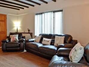 Living room with wood beamed ceiling | Dyffryn Haidd - Afan Holiday Cottages, llanafan/Aberystwyth