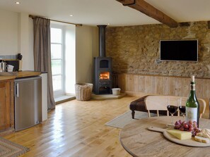 Warm and welcoming open plan living space with wood burner | Bell Cottage - Lebberston Carr Farm, Lebberston, near Filey