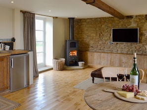 Warm and welcoming open plan living space with wood burner | Bell Cottage - Lebberston Carr Farm, Lebberston, near Filey