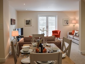 Living room with dining area | Can Duran - Duran Holiday Cottages, Killin
