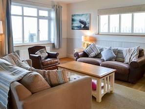 Relaxing living room with cosy wood burner | Gullsway, Beadnell