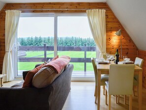 Spacious living area with sliding doors to decked area | Glenlivet View, Glenlivet, near Dufftown