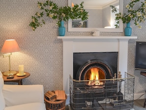 Warm and welcoming living room with open fireplace | Garden Cottage, Strachur, near Dunoon