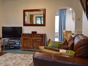 Comfortable living room with open fire | Oakleigh Cottage, Rowen, near Conwy 