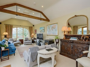 Well presented living room with wood-burning stove  | The Stables, Weedon, near Daventry