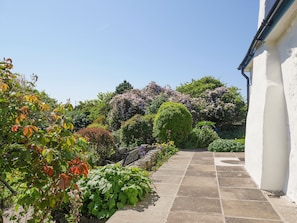 Paved patio area in beautiful garden | Preswylfa, Llanddona, near Bangor