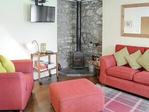 Warm and welcoming living area with wood burner | Birch Cottage - Glenrossal Cottages, Rosehall, near Lairg