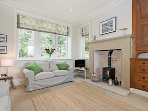 Cosy living room area with wood-burning stove | The Gatehouse at Beckfoot Hall, Kirkby Stephen, near Appleby