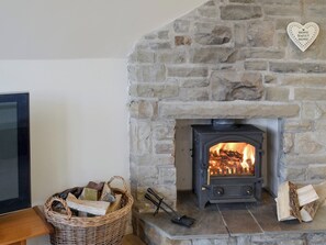 Warming wood burner in living and dining room | Bay View, Hunmanby Gap, near Filey