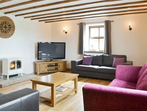 Welcoming living room | Llofft Storws - Bronallt Barns, Llanynghenedl, near Holyhead