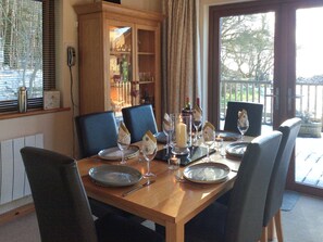 Dining area with access to the decking | Larchwood, Dukes Meadow, near Greystoke