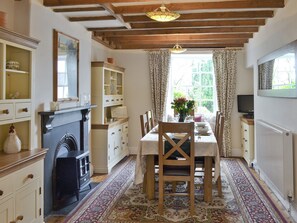 Exposed wooden beams on dining area ceiling | Cherry Tree Cottage, Bellerby, Wensleydale