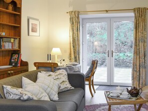 Convenient dining area within living room | Nettlebush Cottage - Drumelzier Place Farm, Drumelzier, near Peebles