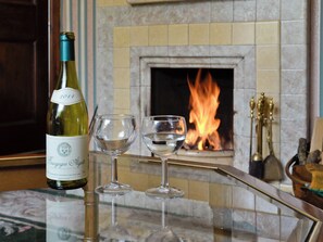 Warming real fire in lounge | Station House - Glyndyfrdwy Station Cottages, Glyndyfrdwy, near Llangollen