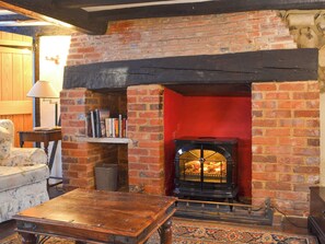 Cosy living room with feature fireplace | Tudor Cottage - Tudor Cottages, Romsey