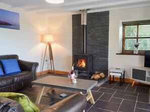 Spacious and warm living room with wood burner | Yr Hen Stabal - Bronallt Barns, Llanynghenedl, near Holyhead