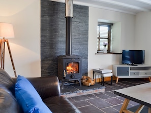 Spacious and warm living room with wood burner | Yr Hen Stabal - Bronallt Barns, Llanynghenedl, near Holyhead