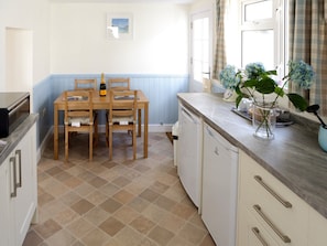 Convenient dining area within kitchen | Manor Cottage, West Pentire