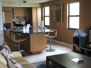 Well equipped kitchen w/bespoke cabinets
and Bosch washing machine & dryer. 