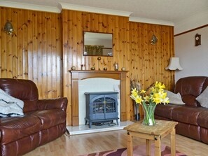 Warm and welcoming living room | Bute Cottage, Daliburgh, South Uist