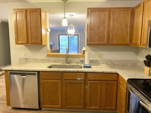 Kitchen opening to living area