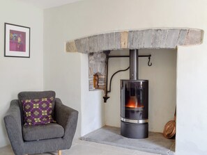 Delightful sitting room with wood burner | The Mill Farmhouse (Ty Fferm Y Felin), Llandybie, near Llandeilo