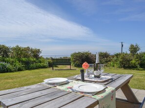 Outdoor eating area | Seafield, Church Bay, Anglesey