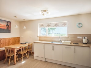 Convenient dining area within kitchen | The Paddock, Portmahomack, near Tain