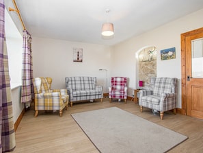 Comfy seating within living room | The Paddock, Portmahomack, near Tain