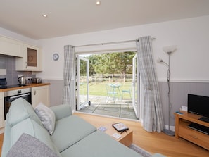Convenient open-plan design with French doors to garden | Barn Owl Cottage, Newton, near Tain