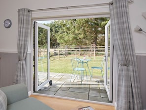 French doors to patio and garden | Barn Owl Cottage, Newton, near Tain