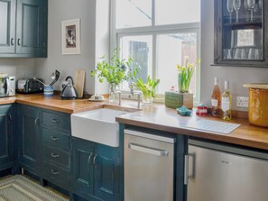 Bespoke kitchen with Belfast sink and oak surfaces  | Dick ’n’ Liddy’s Cottage, Gargrave, near Skipton