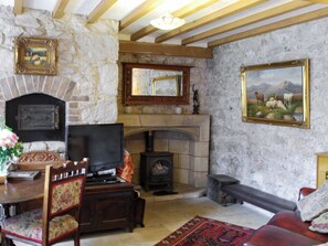 Living area with romantic wood-burning stove  | Hen Wrych Hall Tower, Abergele, Conwy