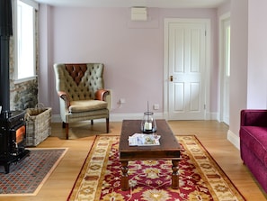 Living room with wood burner | Roseburn Cottage, Moffat