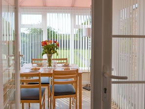 Dining area within the conservatory | Seashore Hideaway - Seashore Hideaway and Seashells by the Sea, Newbiggin-by-the-Sea