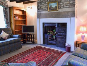 Living room with ornamental period range | Timberwick Green - Akeld Manor, Akeld, Wooler
