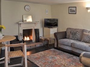 Cosy living room with open fire | Blackberry Cottage, Kenton, near Exeter