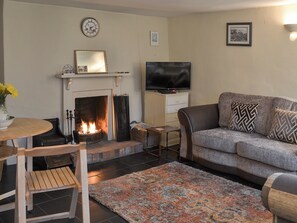 Cosy living room with open fire | Blackberry Cottage, Kenton, near Exeter
