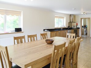 Large open plan kitchen and dining room has French windows that open out to the grounds  | March Cottage, Glen Cassley, near Lairg