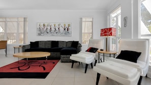 Beautiful, modern furnishings welcome you to living area.