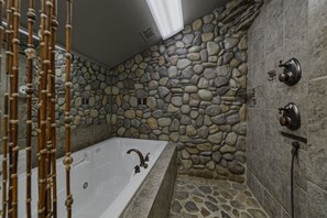 Upper Level Bathroom with Tiled Shower & Jetted Jacuzzi