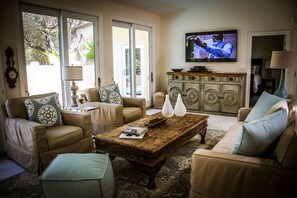 Bright Family Room overlooking the sunny outdoor deck and pool!