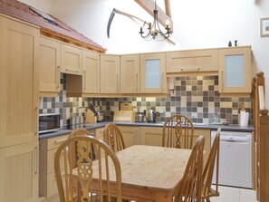 Well-equipped fitted kitchen with dining area | Orchard View Barn - Little Clyst William Farm Cottages, Plymtree, near Cullompton