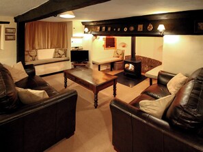 Large living room with sit-in inglenook fireplace with wood burning stove, original bread oven and oak beams | Oddwell Cottage, Brompton Ralph, near Wiveliscombe