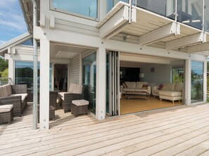 Outdoor furniture on decking and bi-fold doors to living area | Silver Dawn, Horning, near Wroxham